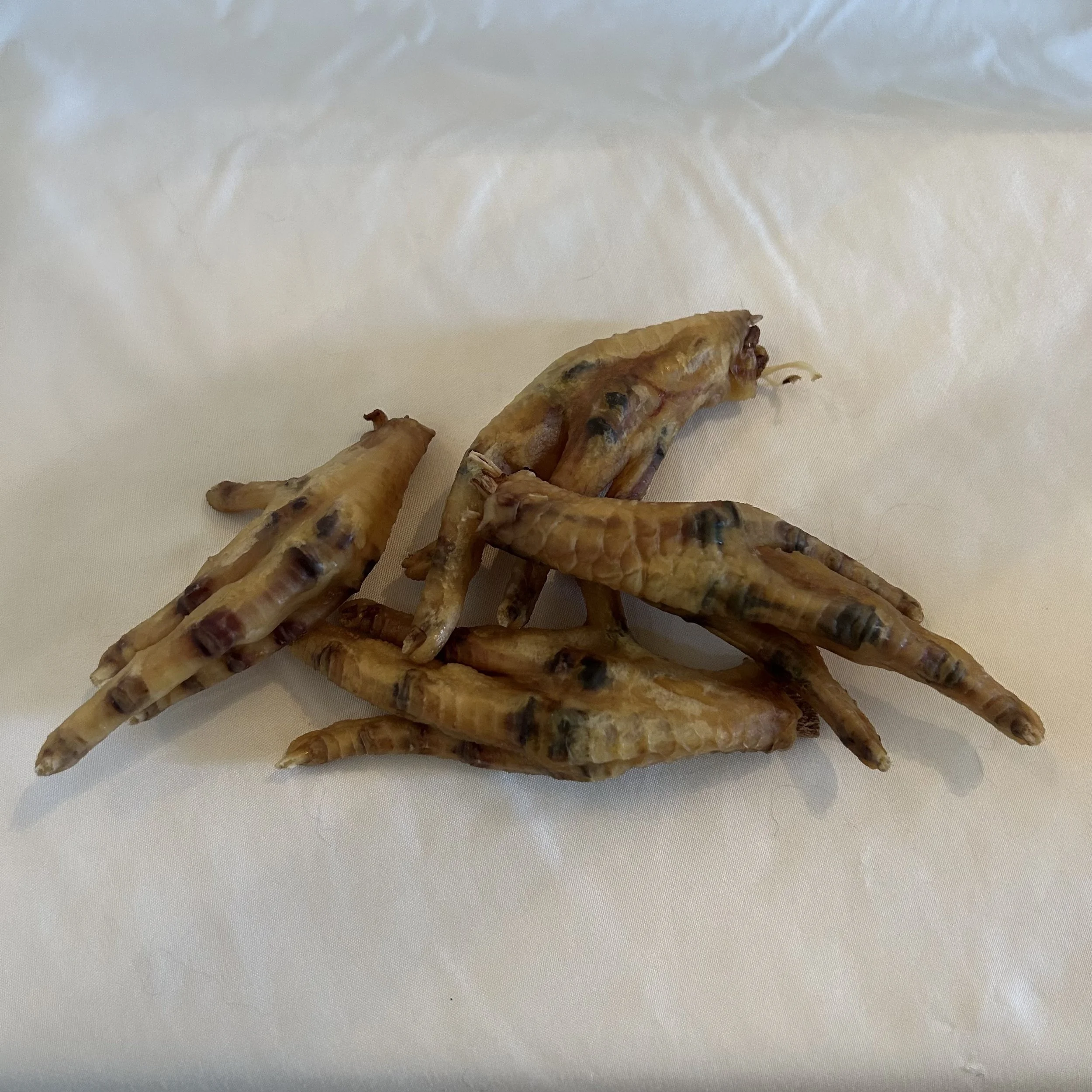 All-natural single-ingredient dehydrated chicken feet dog treats