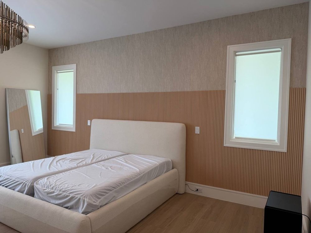 Wood slat bedroom accent wall behind the bed, Monroe NC
