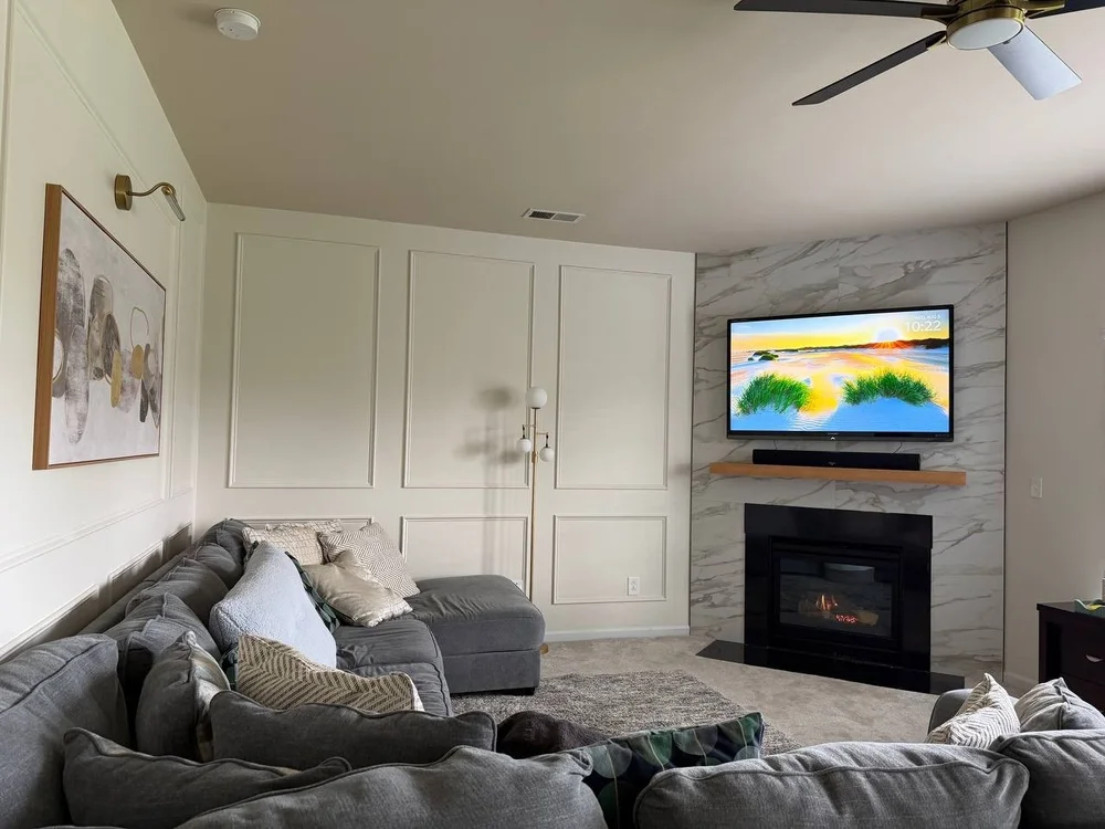 Decorative wall molding with picture light in a living room, Charlotte NC