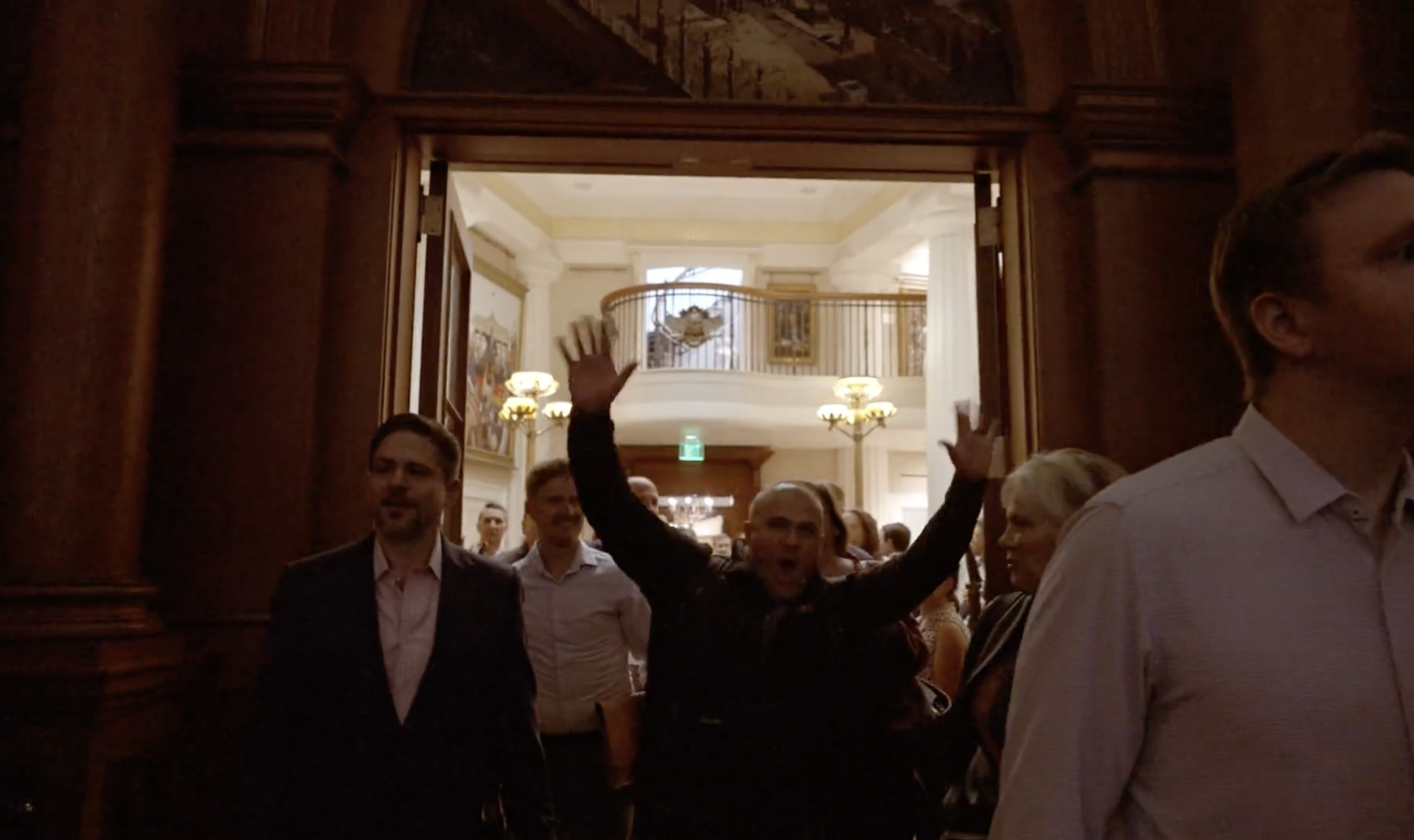 Attendees entering the room
