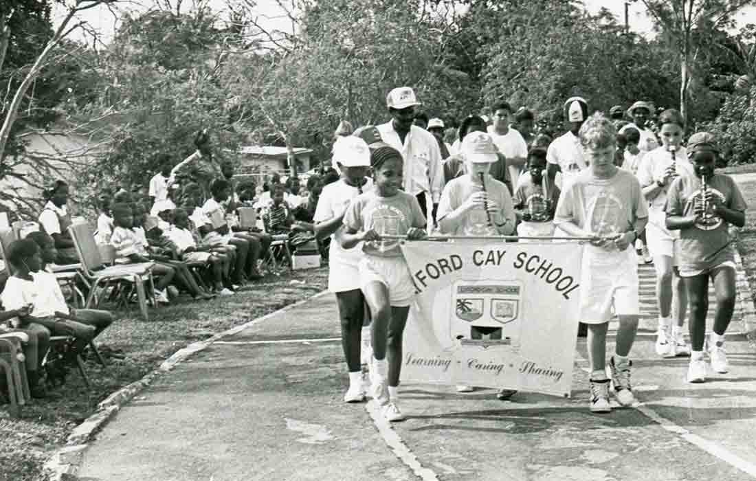 Vintage black and white photo of LCIS student in a parade..