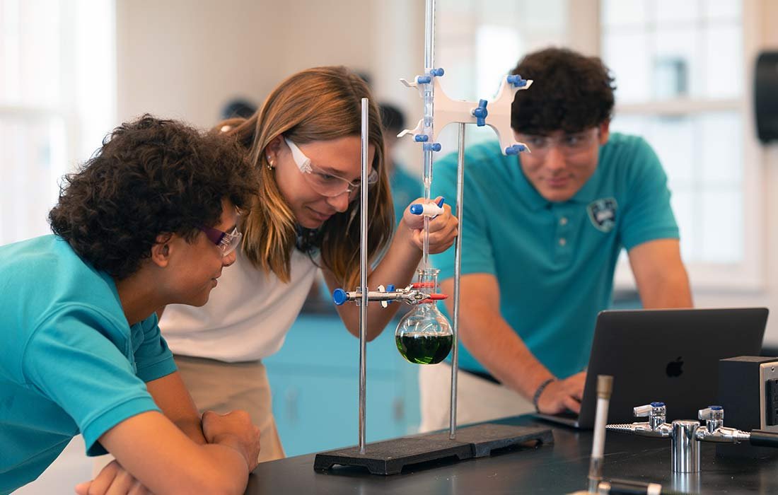 Three students in science lab