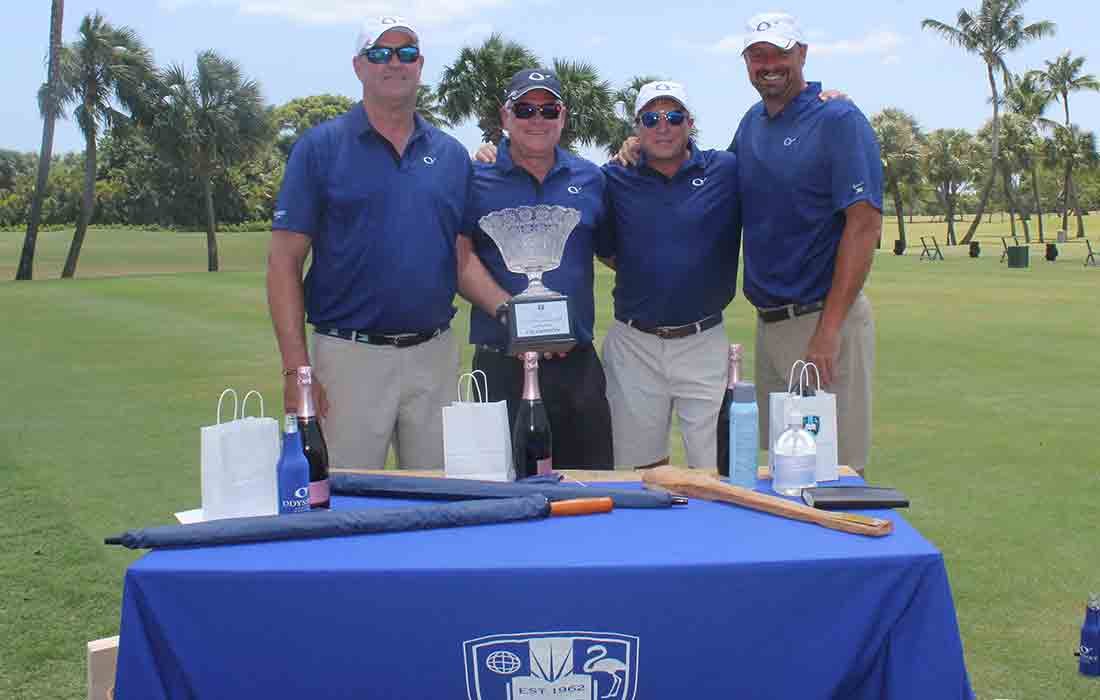 Golf tournament participants at the prize table.