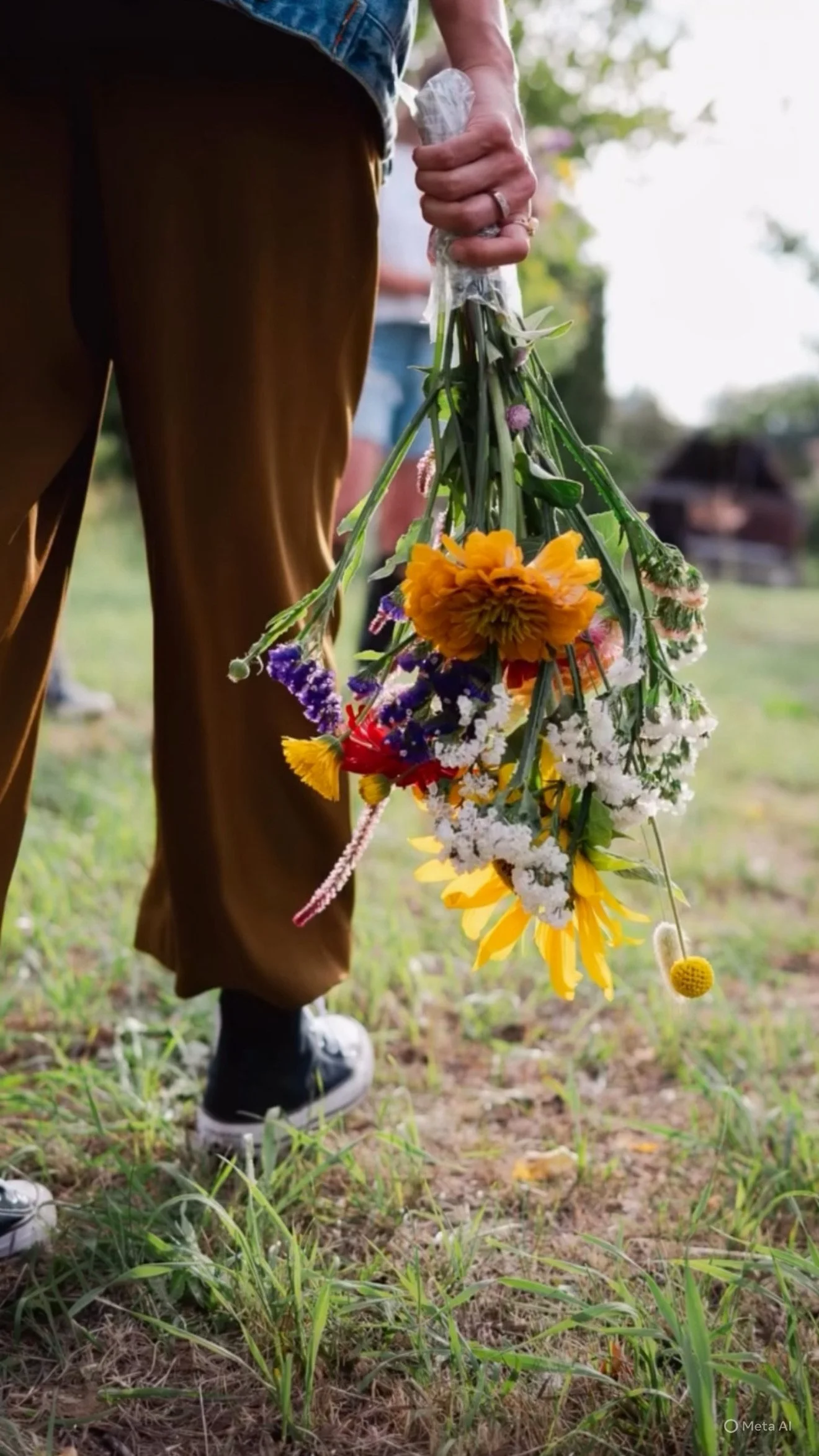 Walking the farm with a fresh bouquet at Stewberry U-Pick