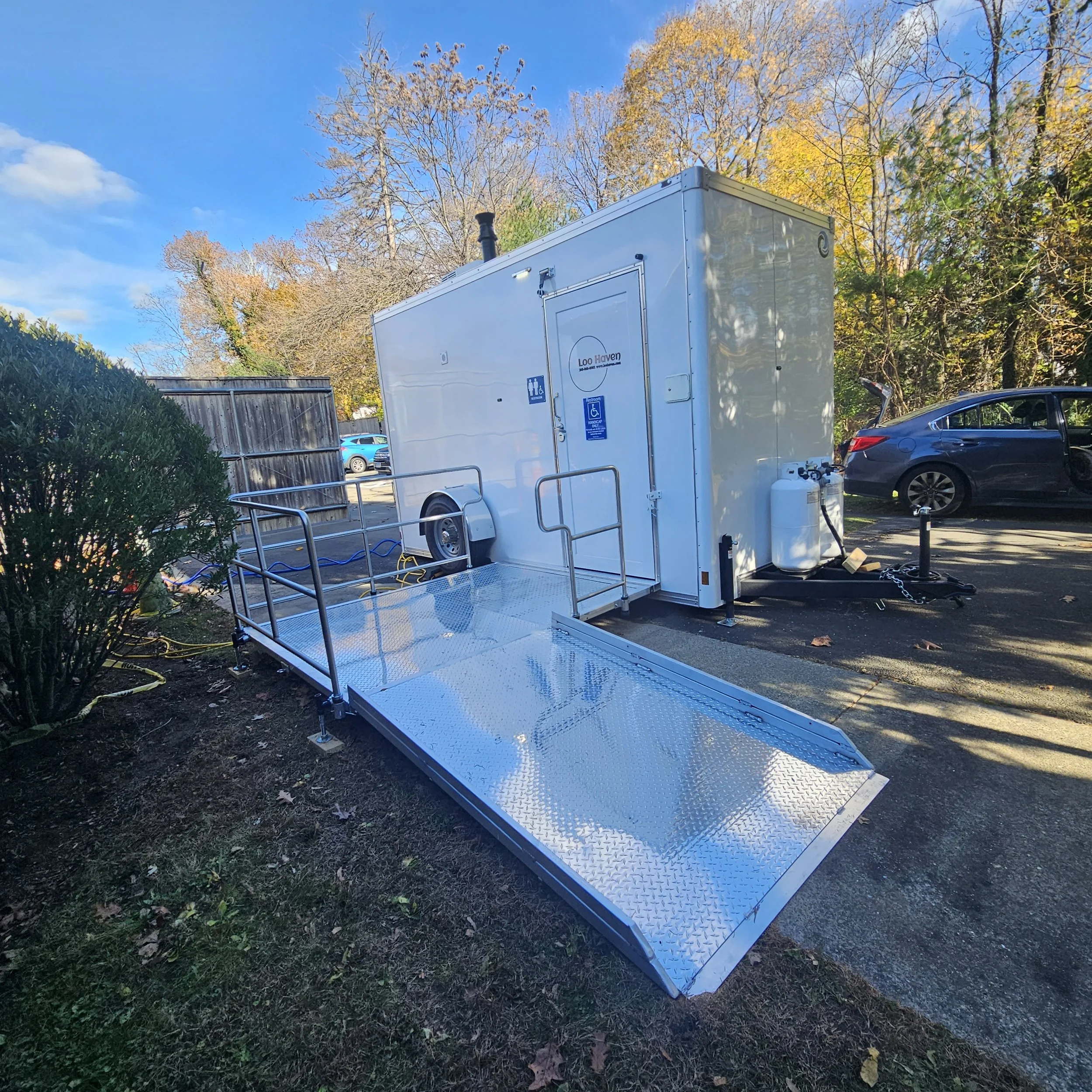 ADA-accessible luxury restroom trailer with ramp