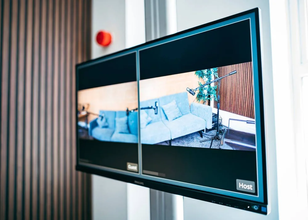 Professional podcast recording room with microphones and studio setup