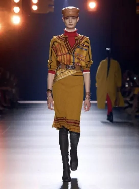 Hermès runway look in mustard knit and skirt
