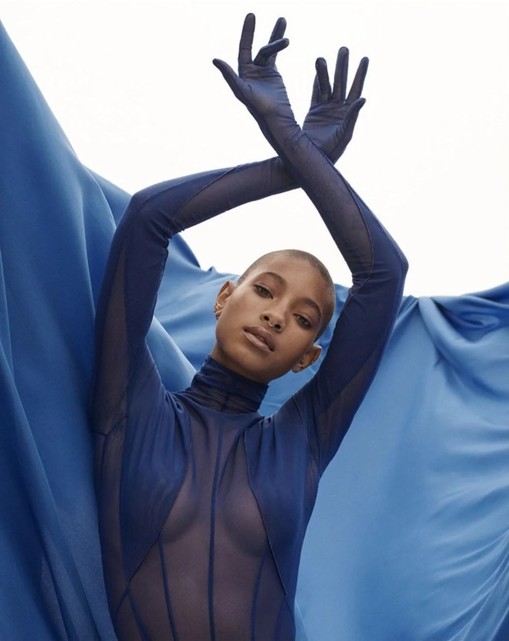 Willow Smith in navy sheer bodysuit with blue fabric