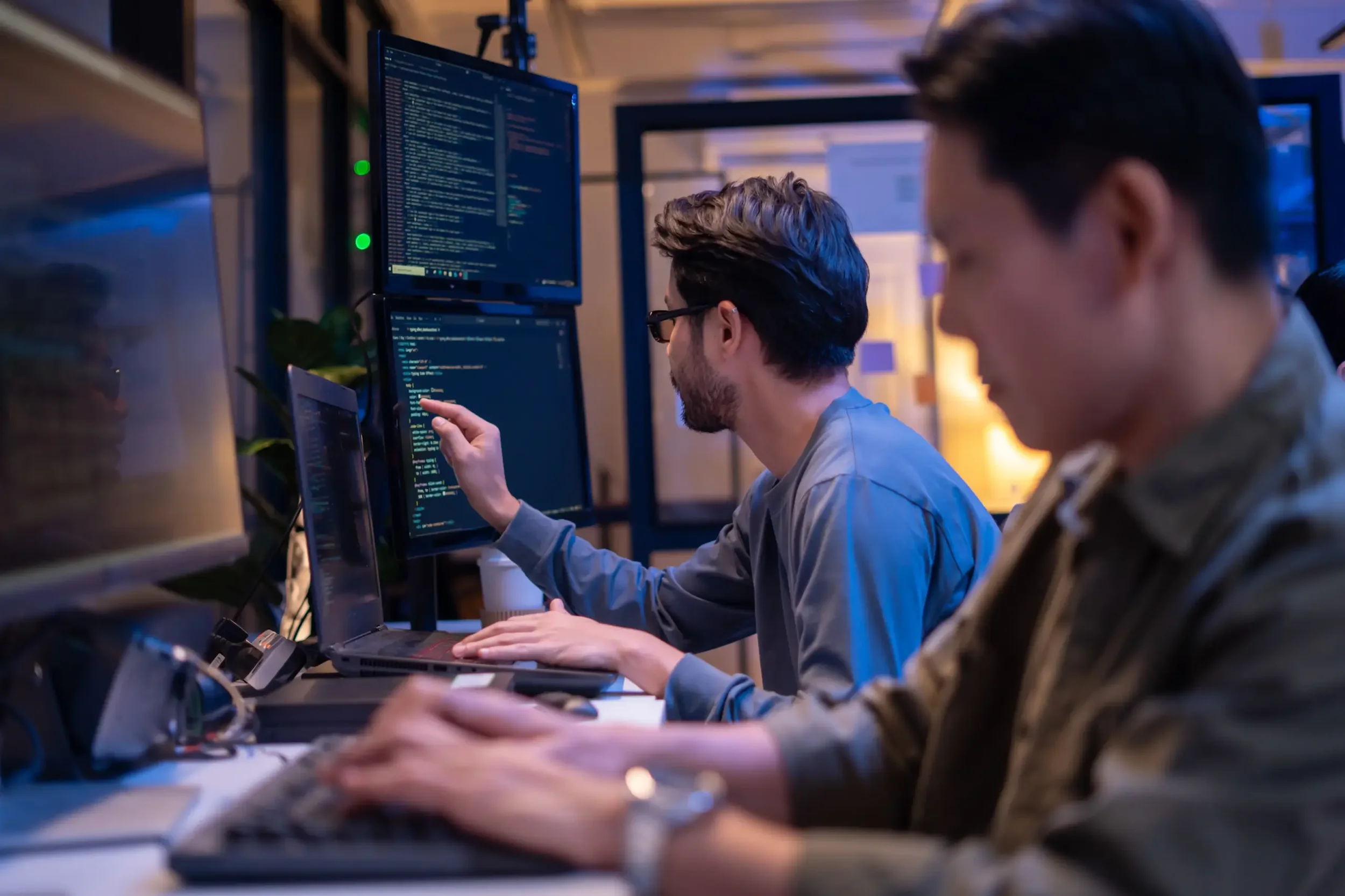 Engineers collaborating at workstations