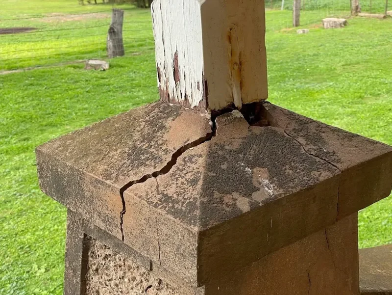 Cracked masonry pier under a timber post
