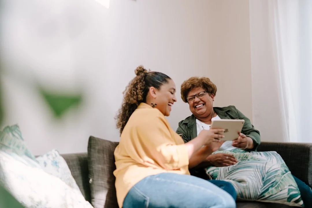 Mother and daughter laughing together at a college send-off experience hosted by The College Psychiatrist