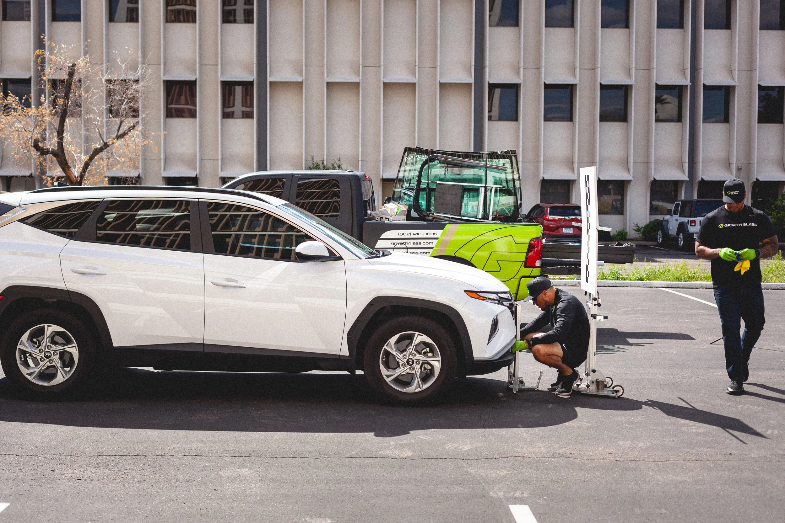 Gryath Glass workers preparing a vehicle for glass replacement