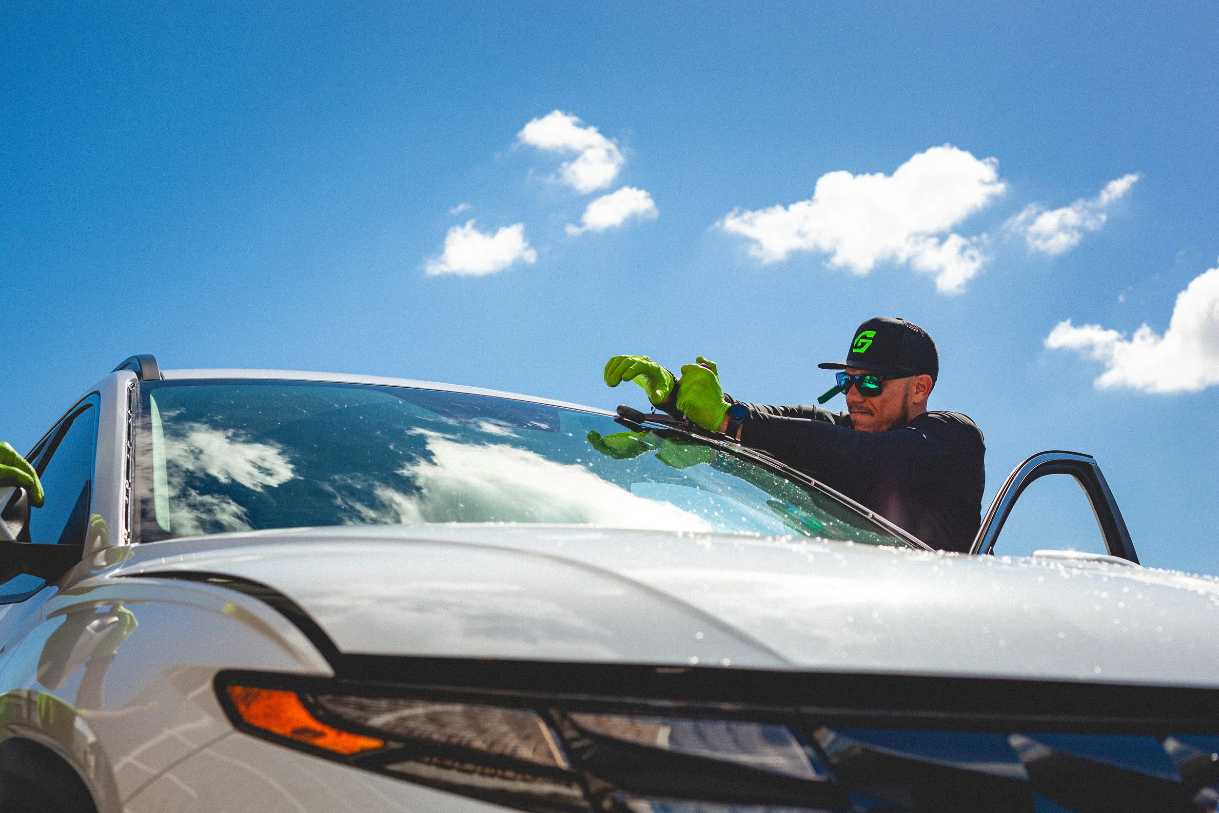 Windshield of white van being removed by Gryath Glass technician