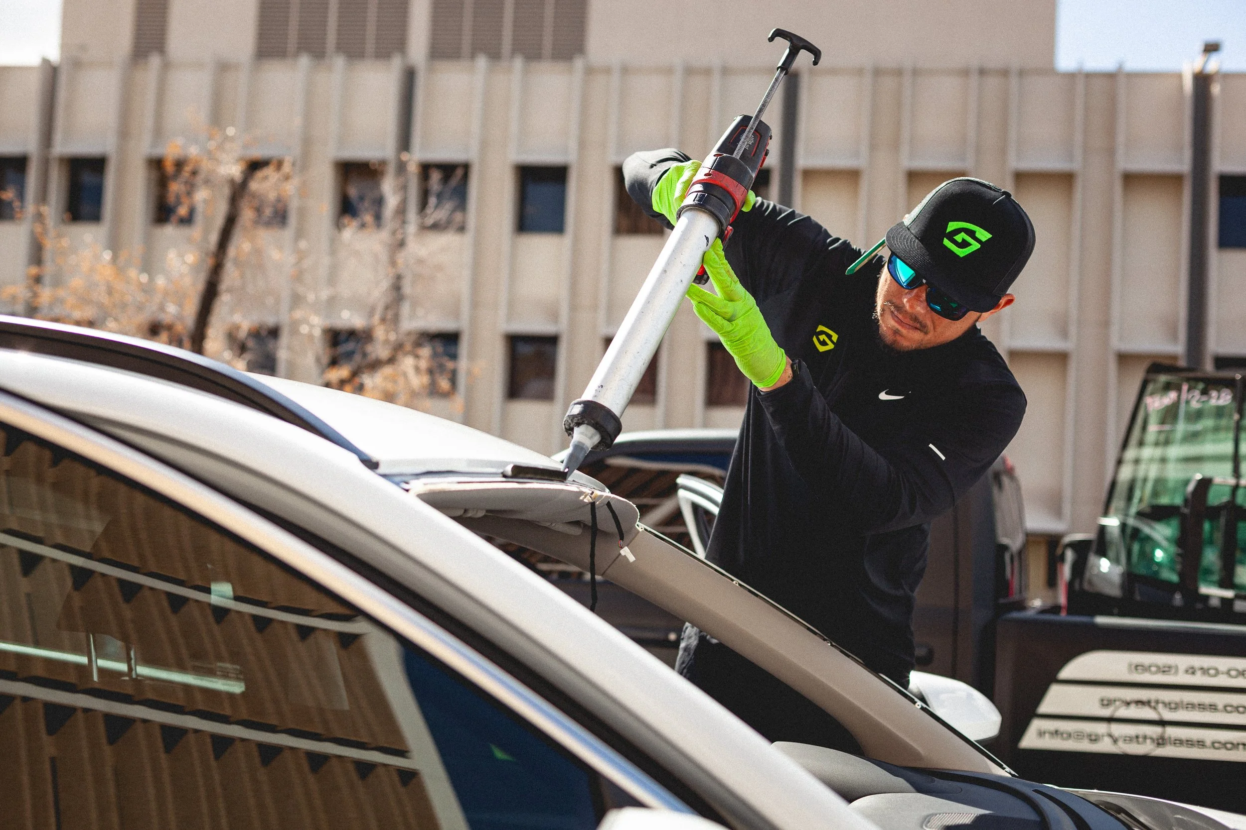 Ivan Hernandez applying Sika Ultimate adhesive to a windshield