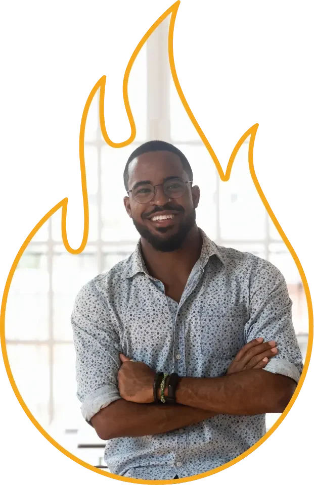 Smiling leader standing with arms crossed