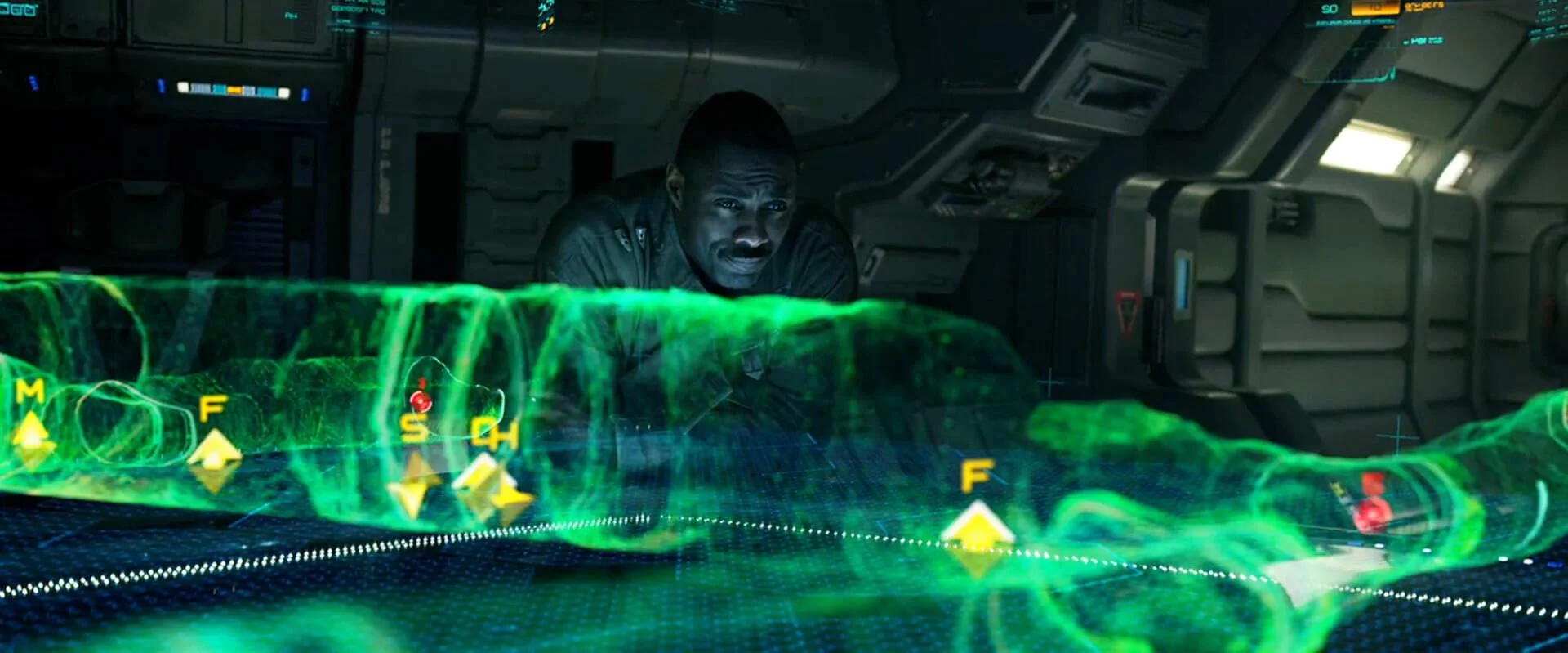 Janek studies a green holographic terrain map on the Prometheus bridge