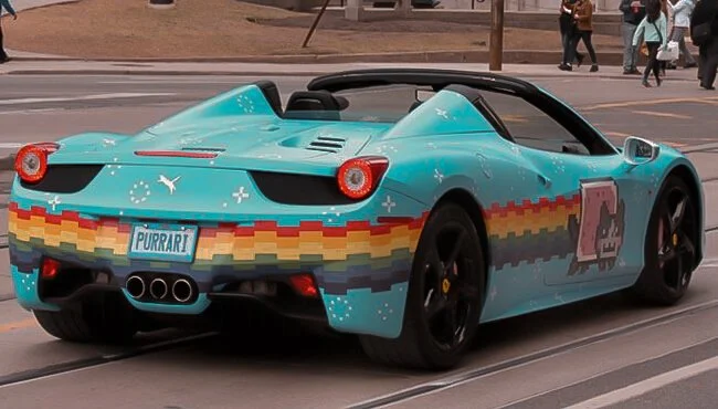 Nyan Cat–wrapped Ferrari 458 — rear three‑quarter with rainbow tail