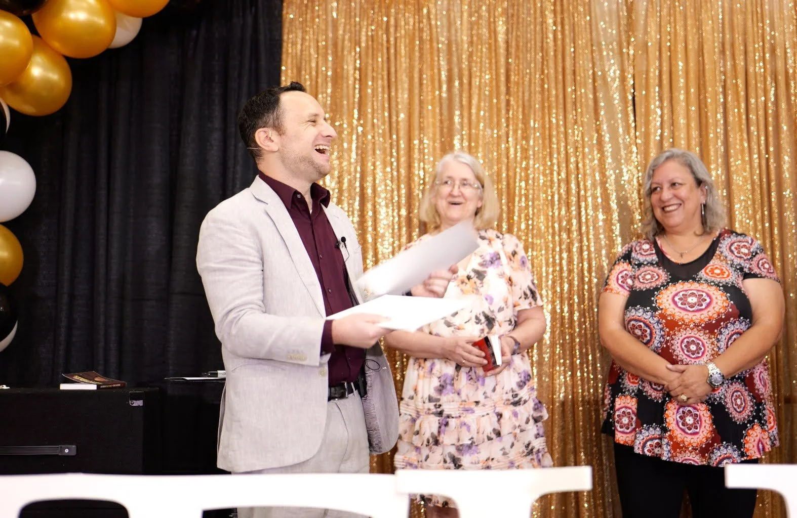 Corporate magician Ari Novick creating interactive entertainment for guests at a company event in Jacksonville, Florida.