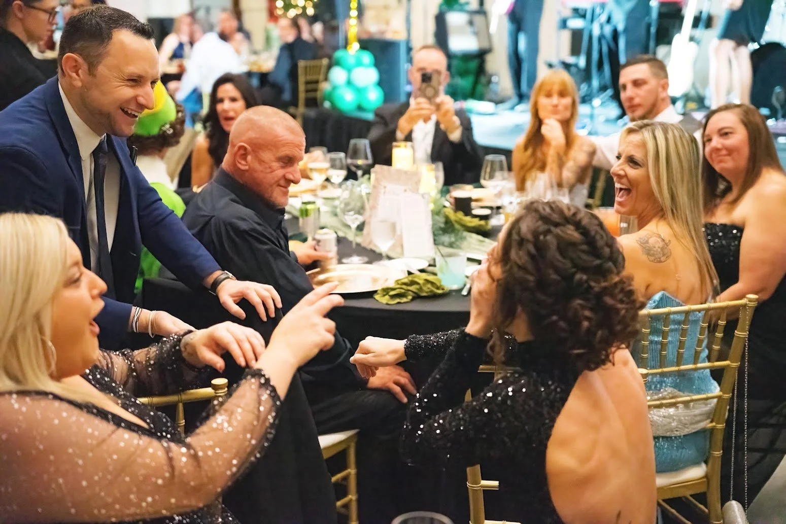 Corporate magician Ari Novick performing interactive close-up magic for guests at a corporate event in Orlando, Florida.