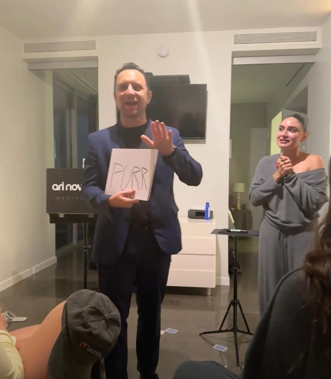 Ari Novick performing interactive magic for guests at a bachelorette party.