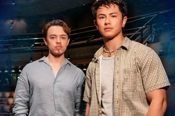 Two Death Note cast members standing together on stage