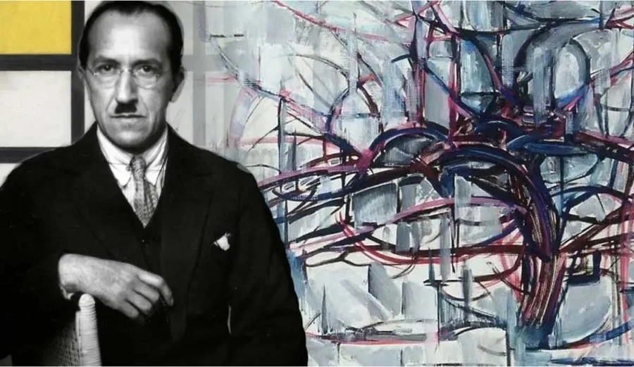 Piet Mondrian, with one of his paintings