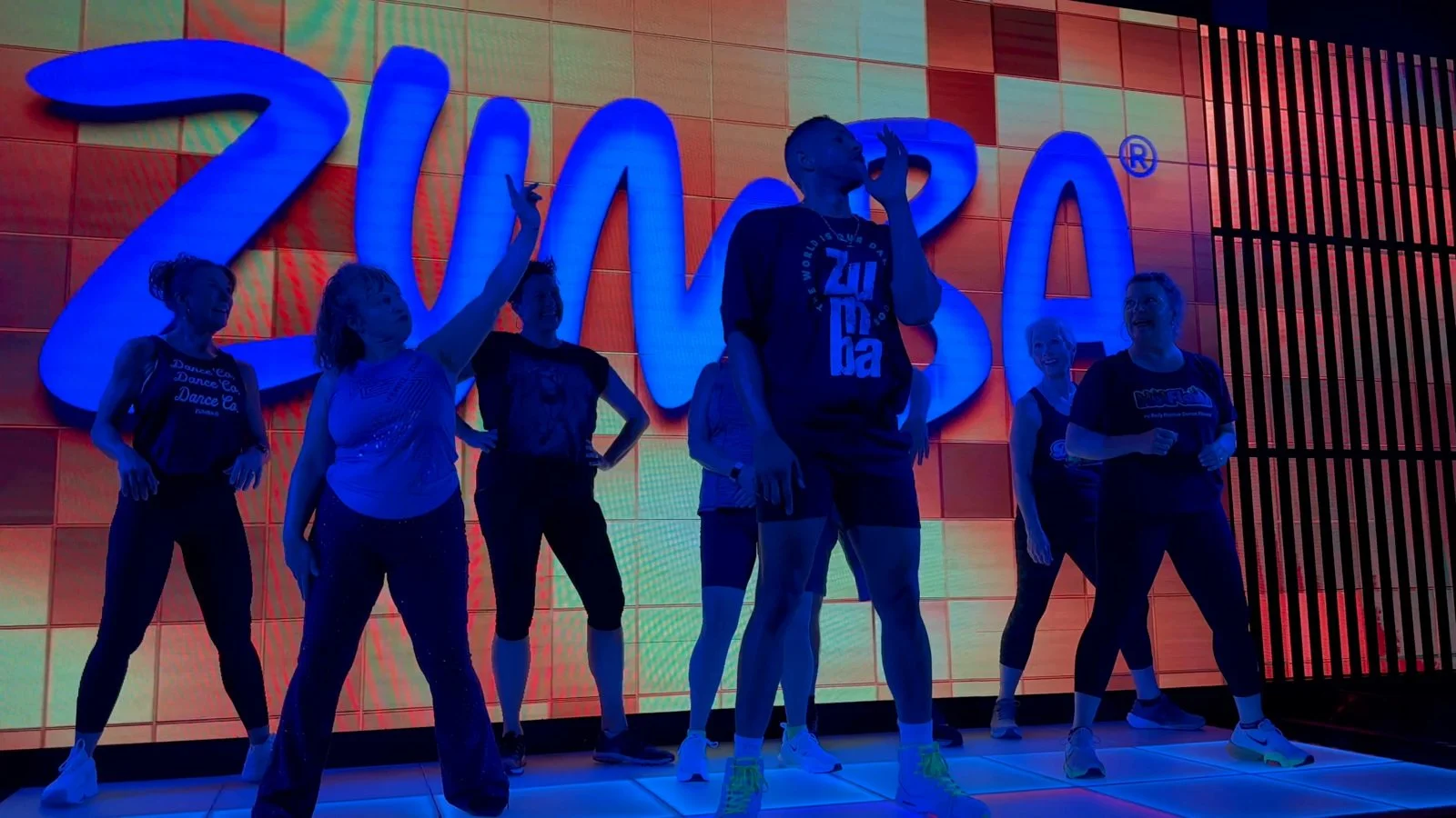 A still from the Miami Zumba stage video, with the group dancing together