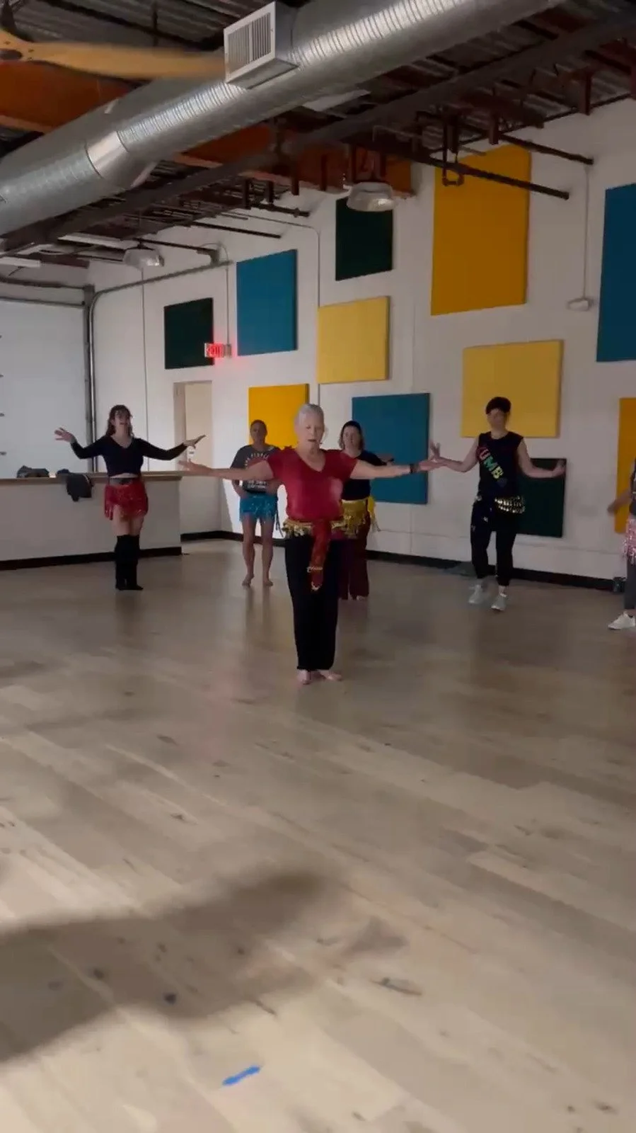 Participants trying belly dancing at a past Friday Happy Hour class