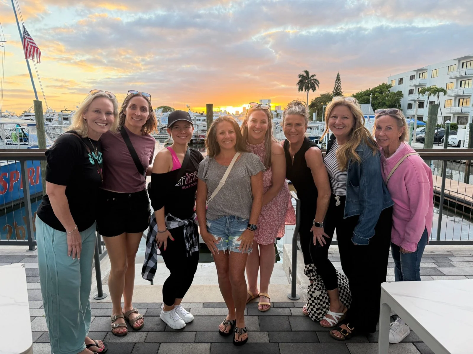 BPDF friends together by the waterfront at sunset