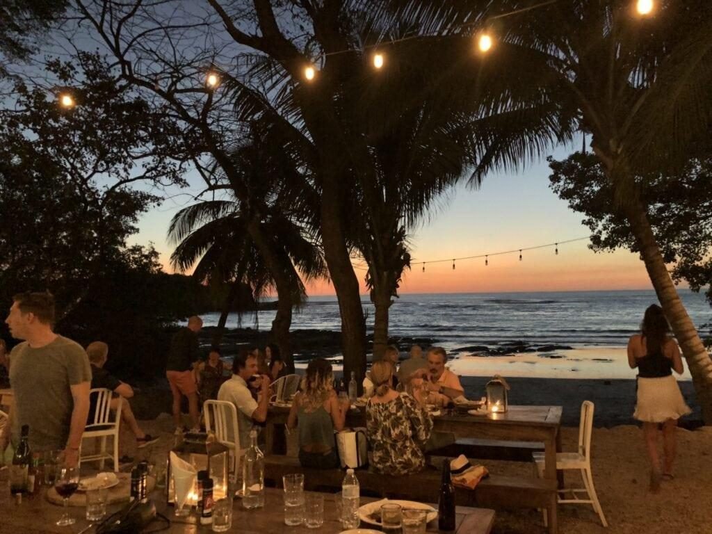 a beachside dinner at dusk