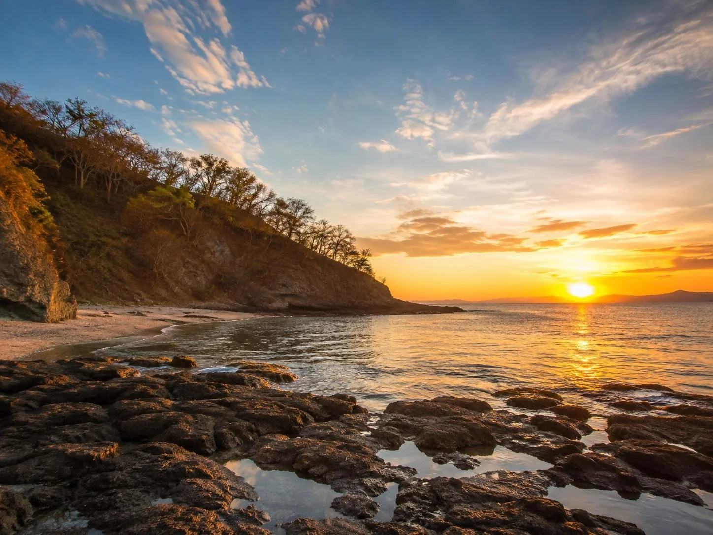 a rocky cove at sunset