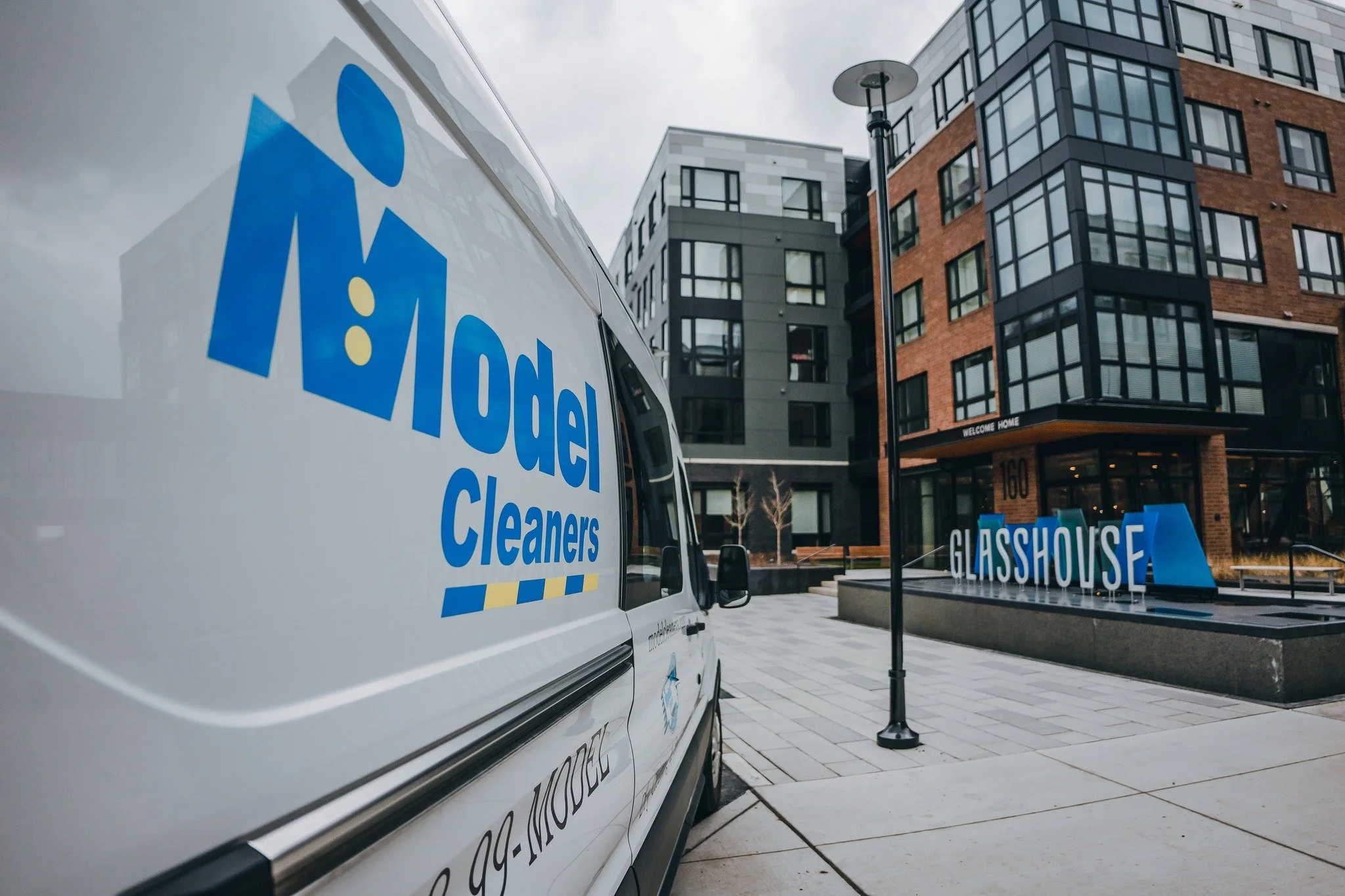 Apartment dry cleaning pickup service from Model Cleaners outside a Pittsburgh residential building