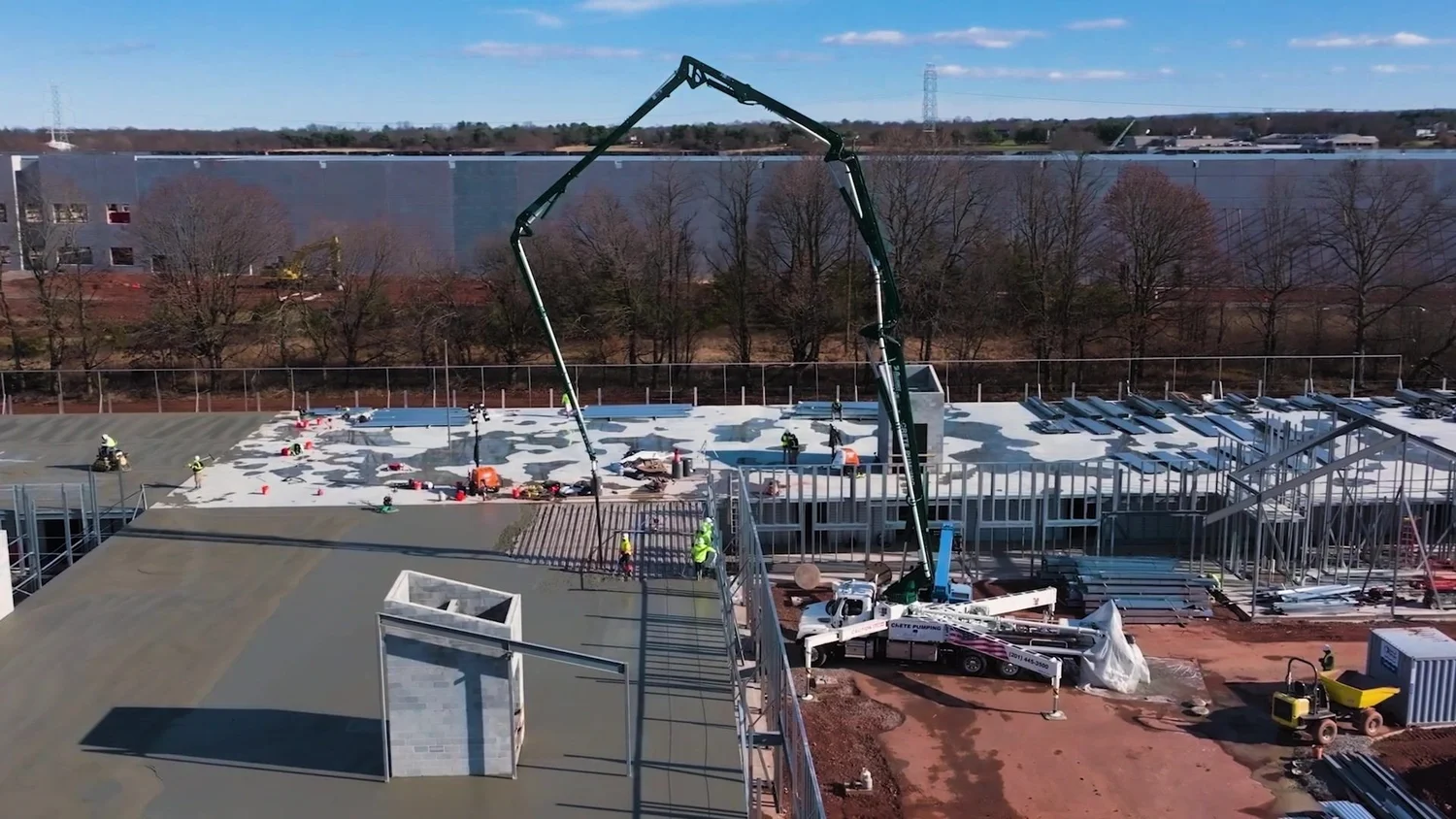 Concrete pump boom over an elevated deck on a TG Basile job
