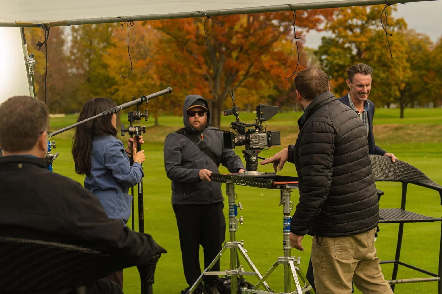 Loud Media crew working a slider, boom and field monitors on a golf course shoot