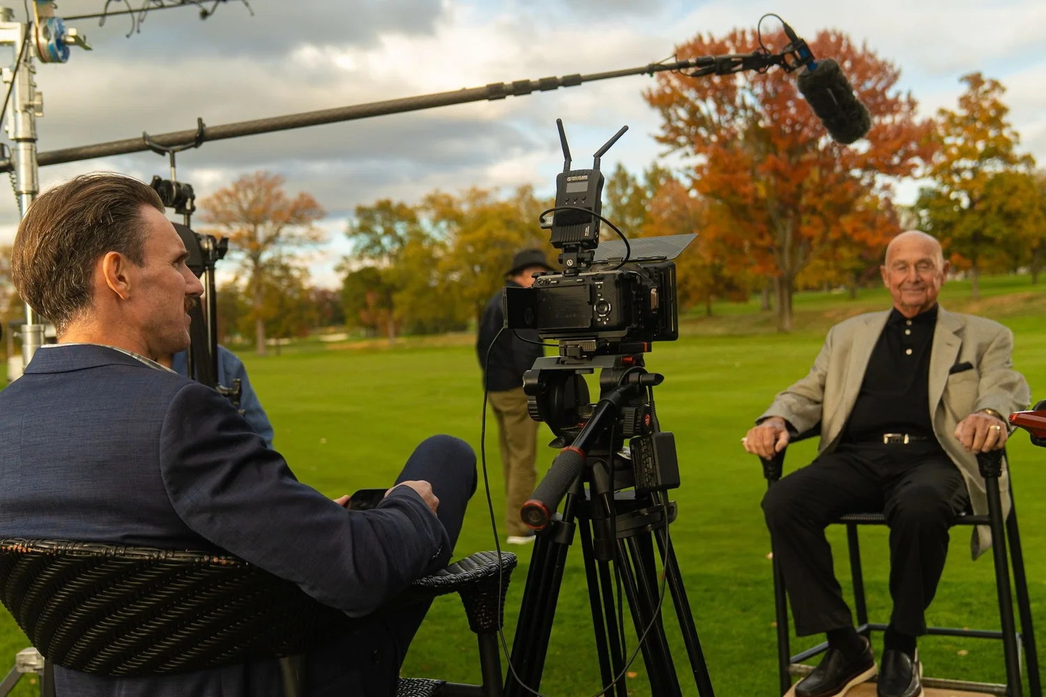 Boom mic over a member interview on the course for a country club anniversary film