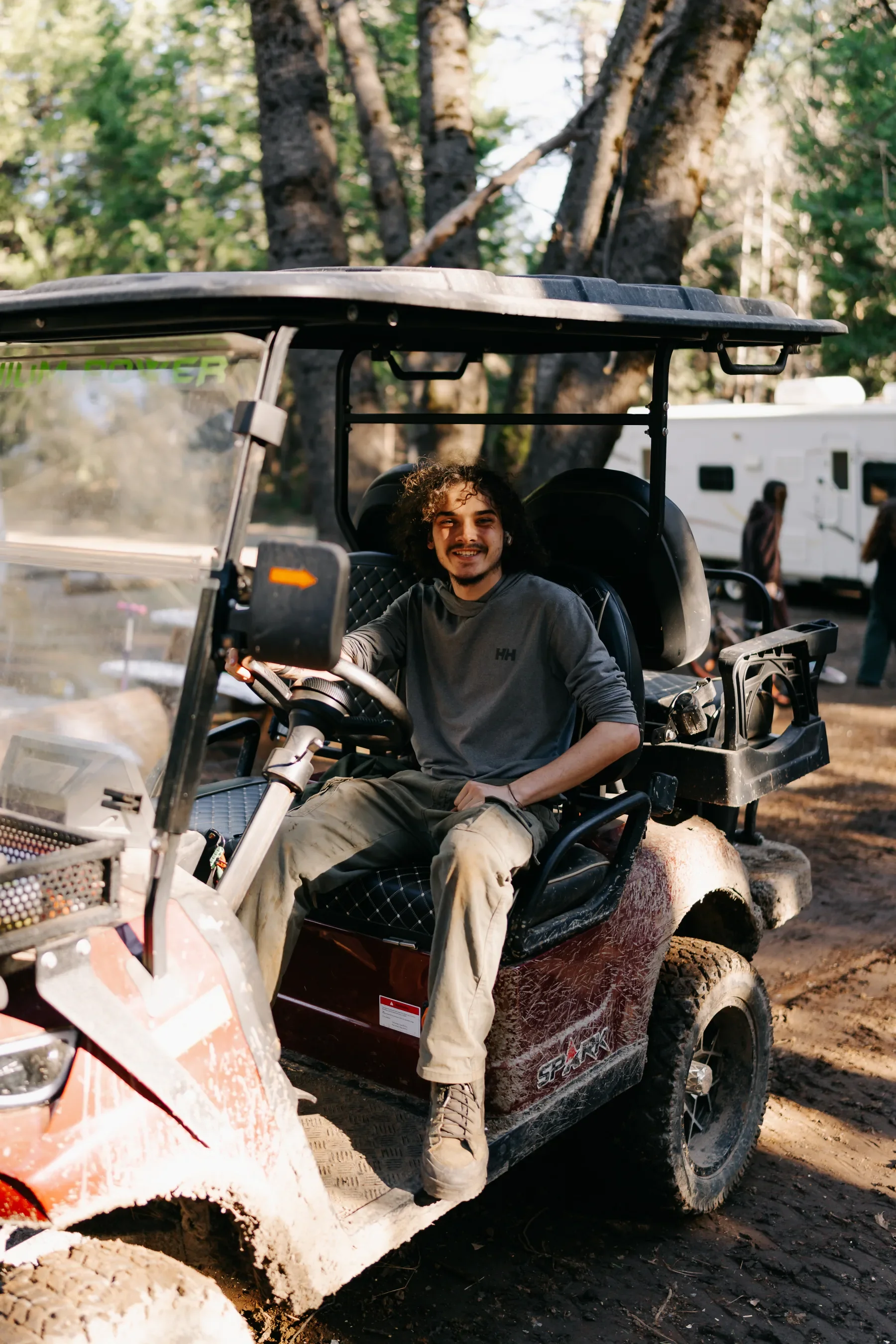 Talan seated on the Fox Sparrow golf cart