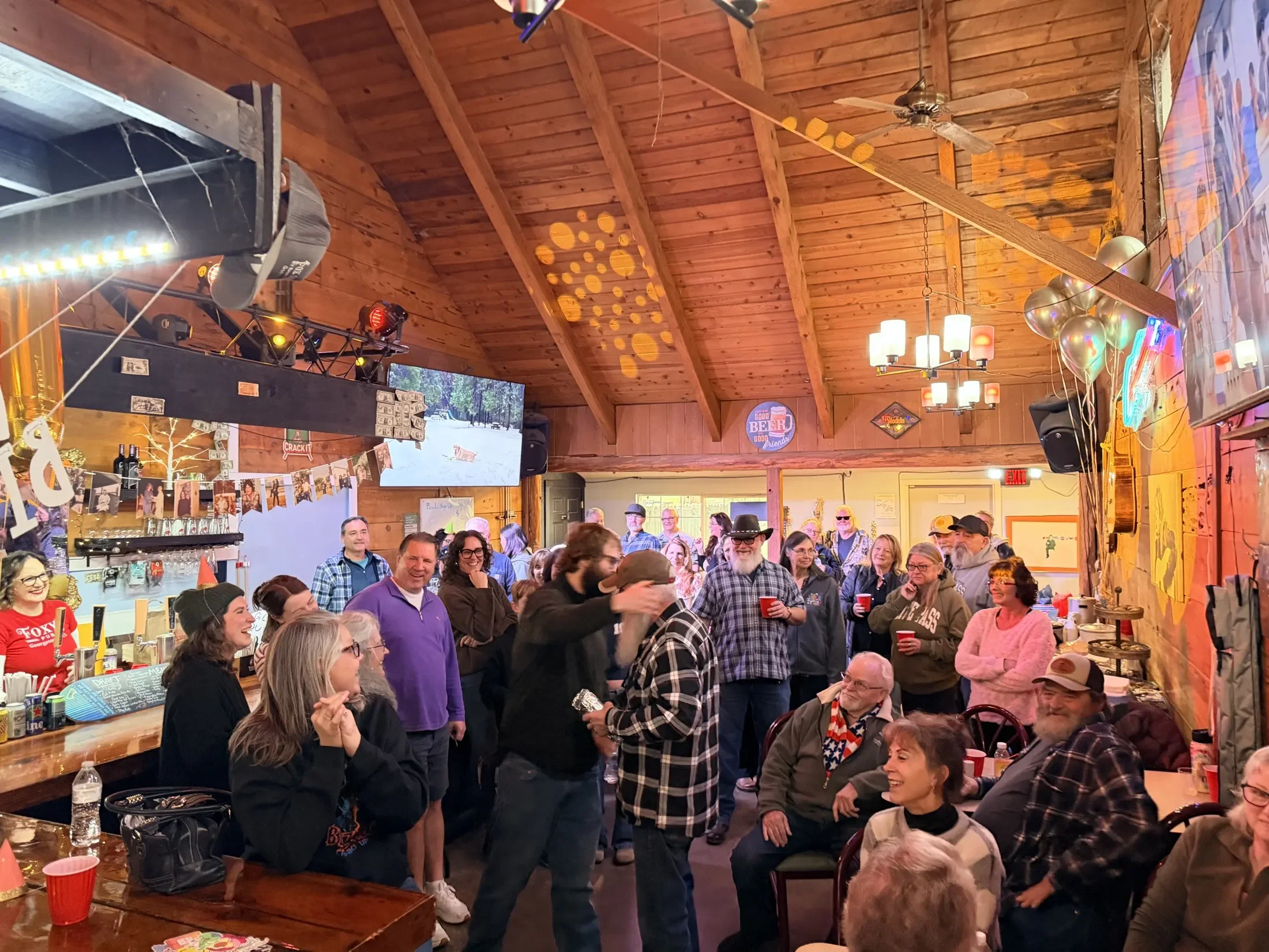 Guests enjoying an evening together at Foxy’s Pub