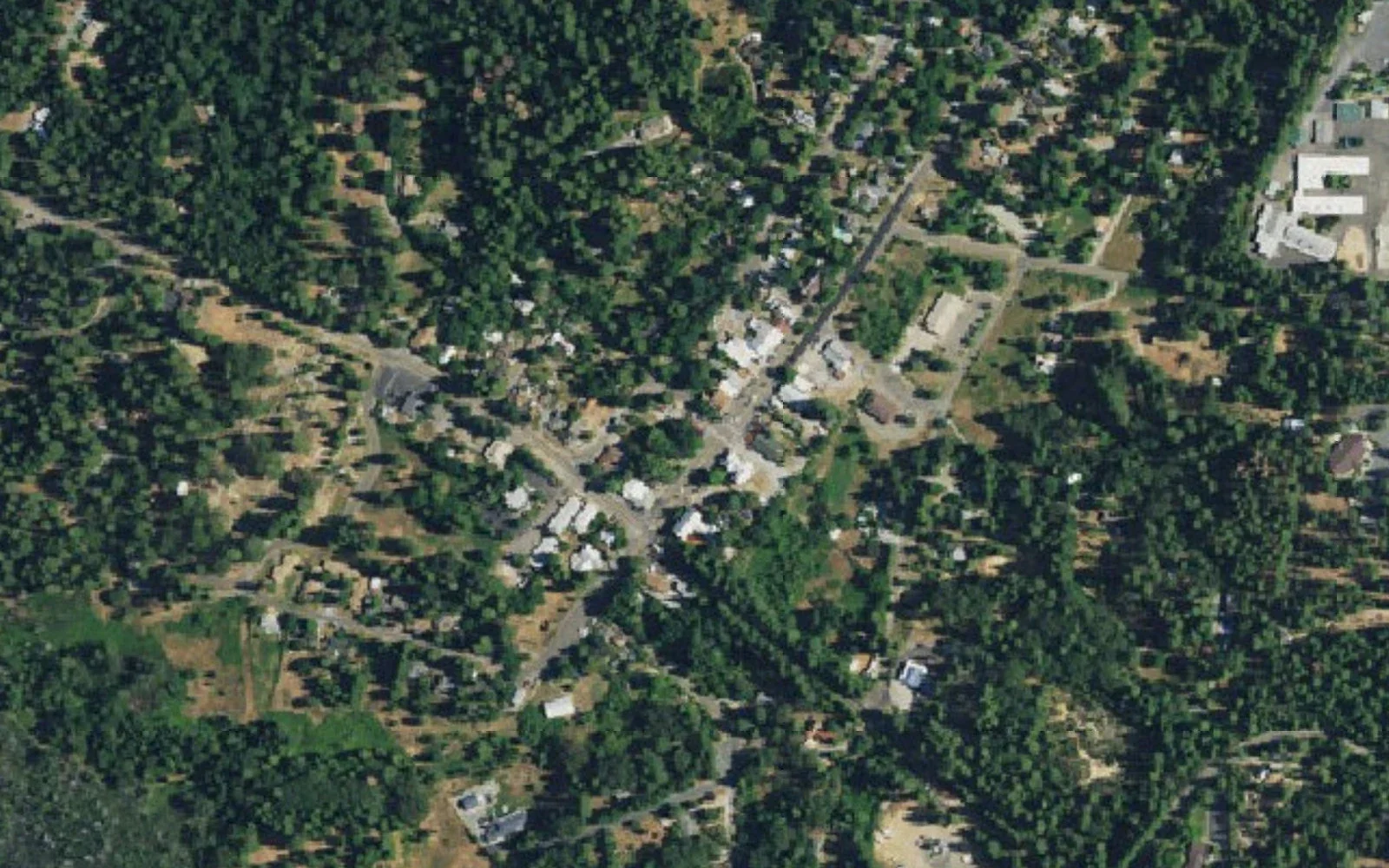 Aerial view of historic Georgetown, California, surrounded by forest