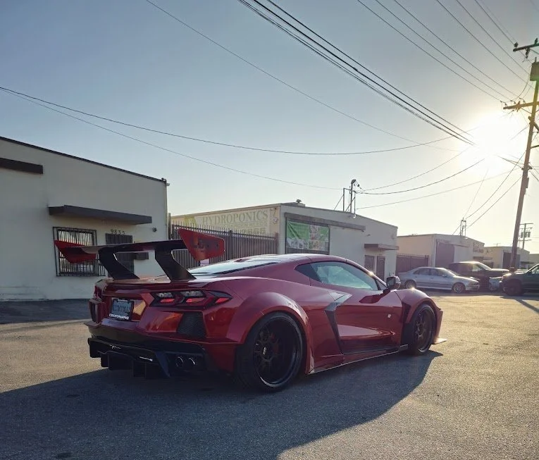 A perfectly detailed sports car gleaming in the sun.