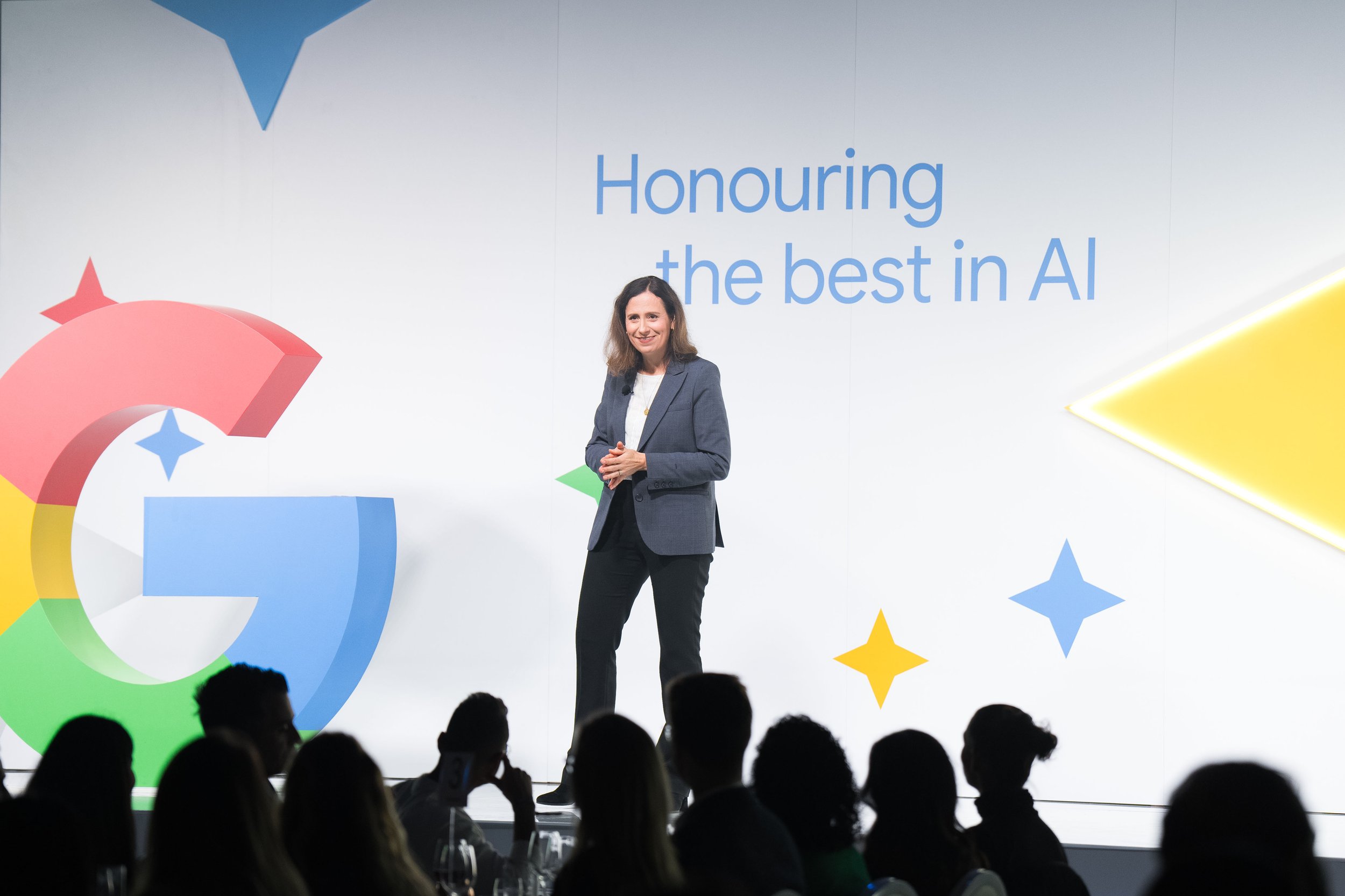 Speaker presenting on 'Honouring the best in AI' at a Google event, emphasizing advancements in artificial intelligence.