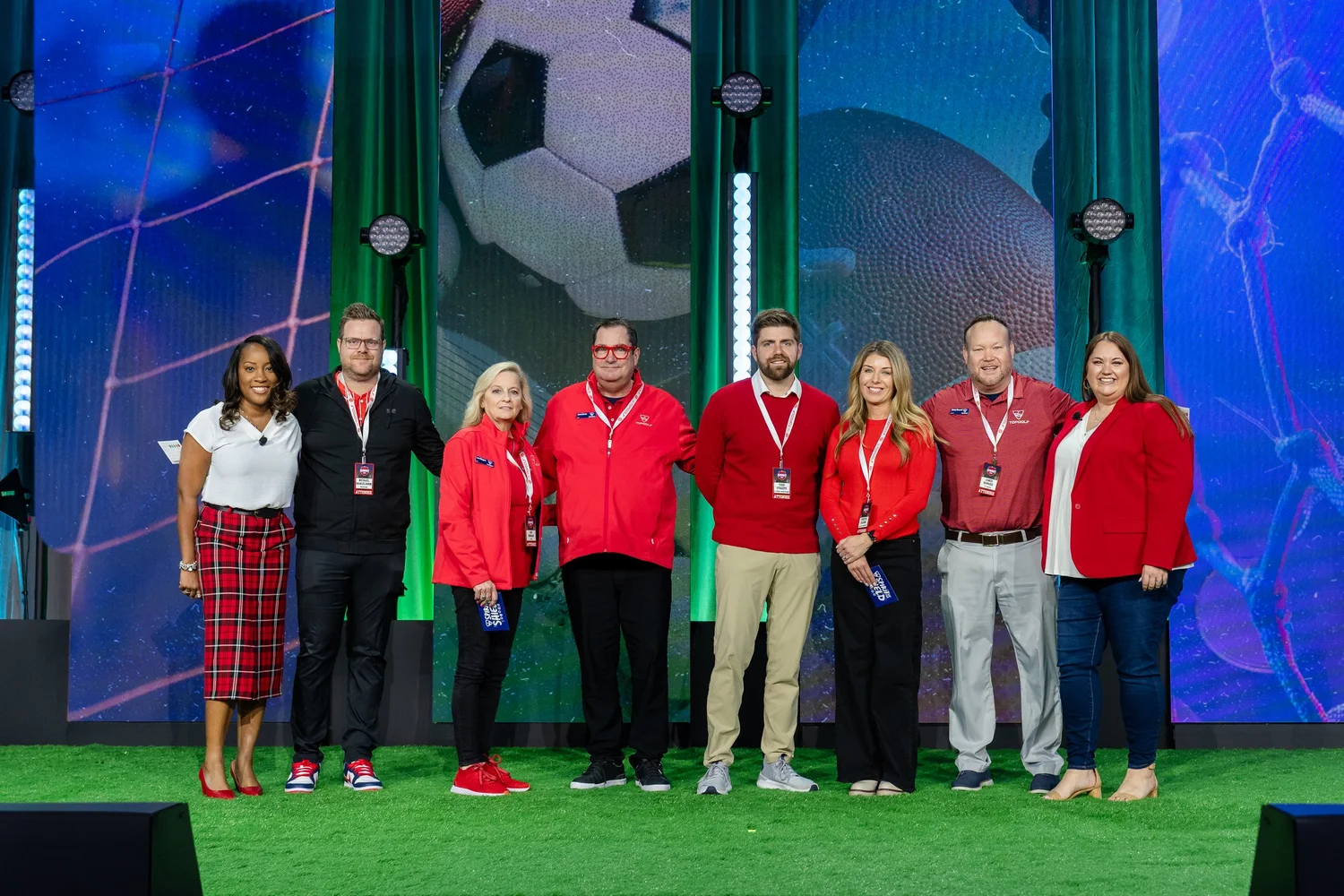 Team on stage at Topgolf Maker 2026, photographed by Uptown Media