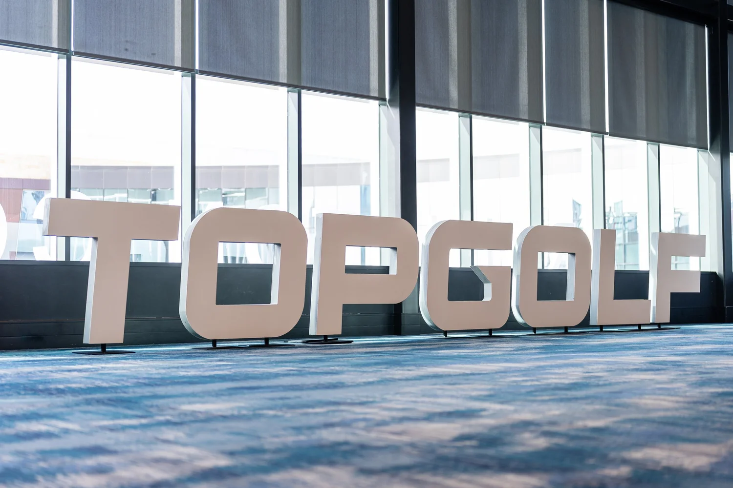Brand letters at Topgolf Maker 2026, photographed by Uptown Media