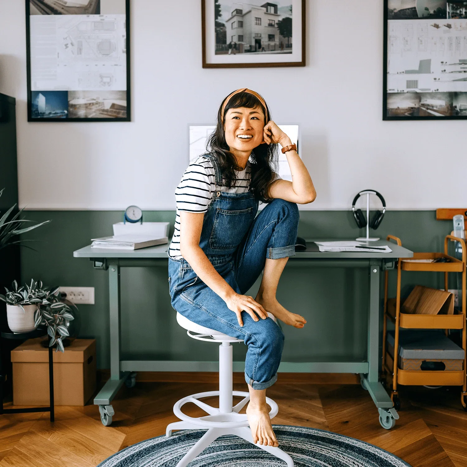 woman smiling at desk while accessing business learning resources