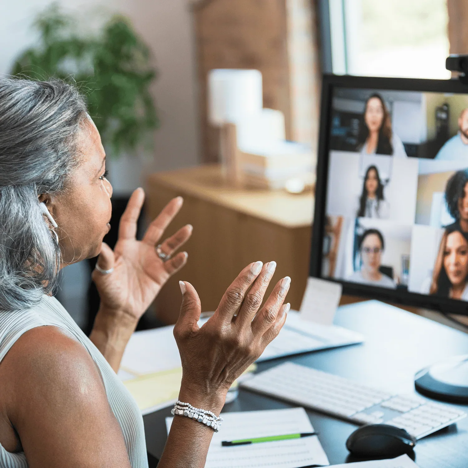 woman leading group video call offering business support and guidance