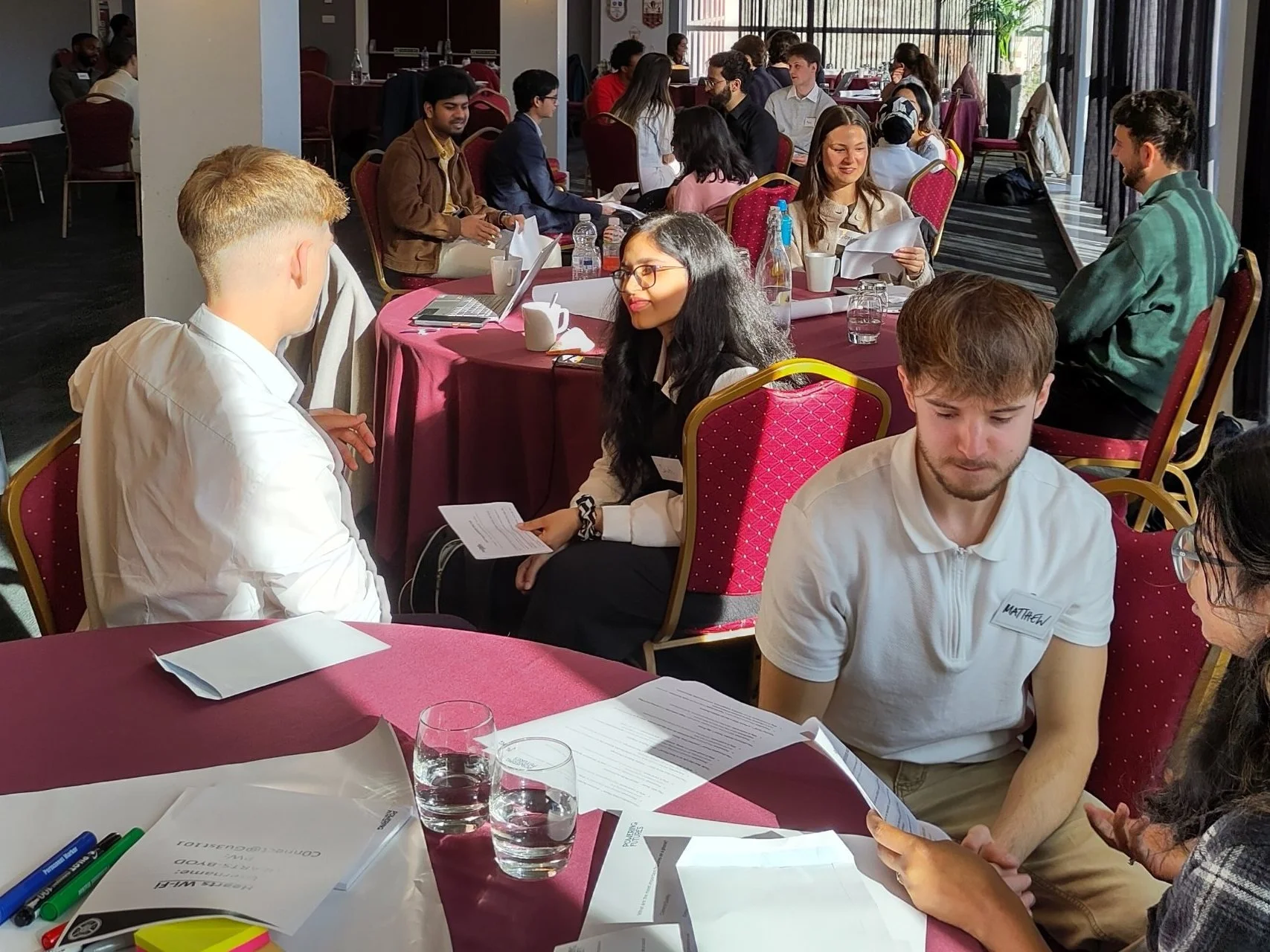 Graduate FastTrack teams working together at an in-person session
