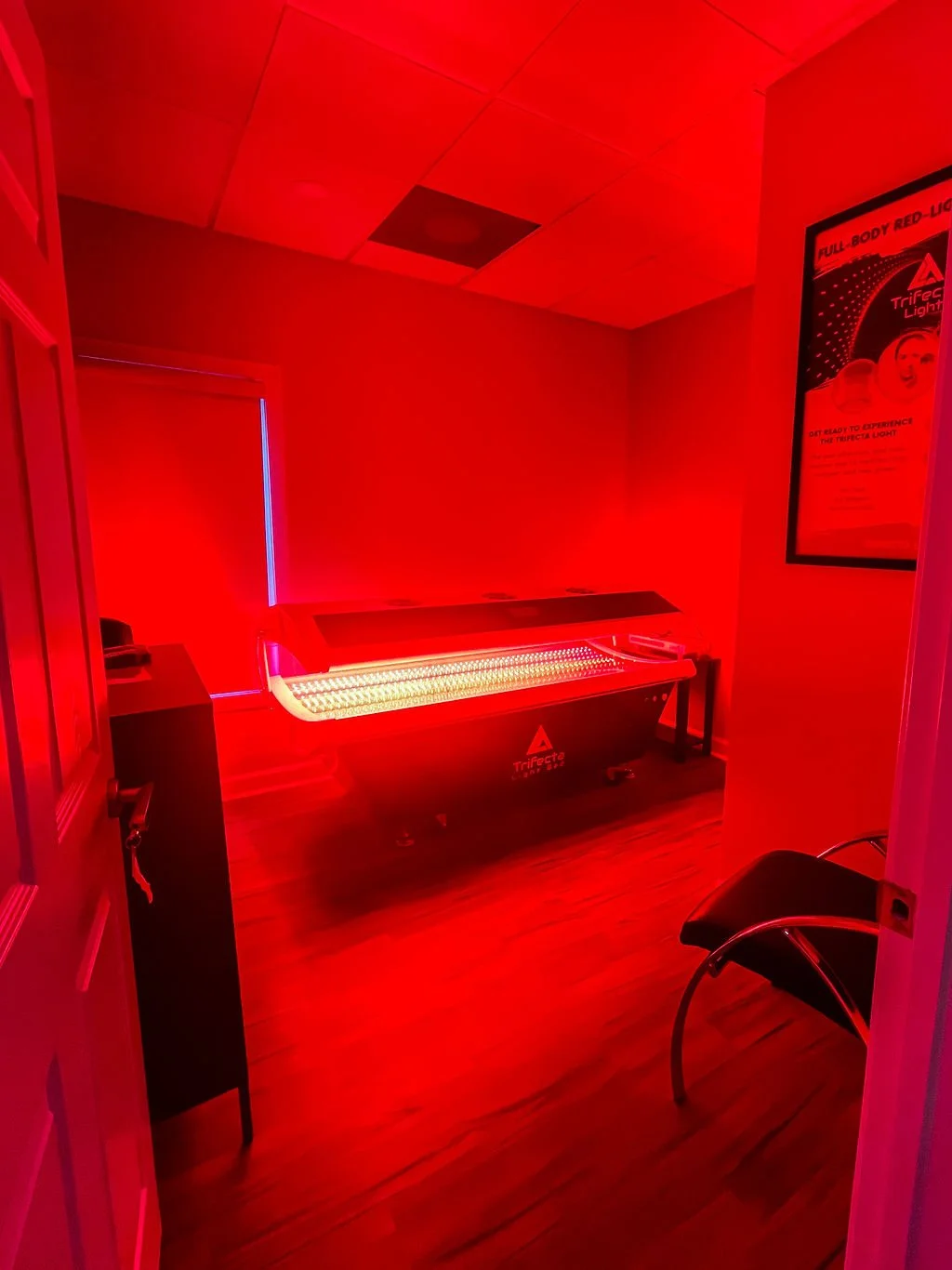 Trifecta red light bed glowing in its private room