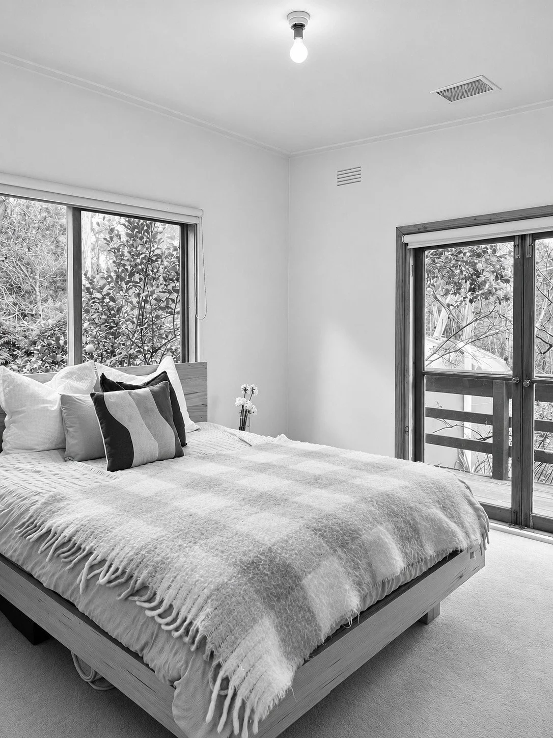 Before: a bedroom with sliding doors to a balcony