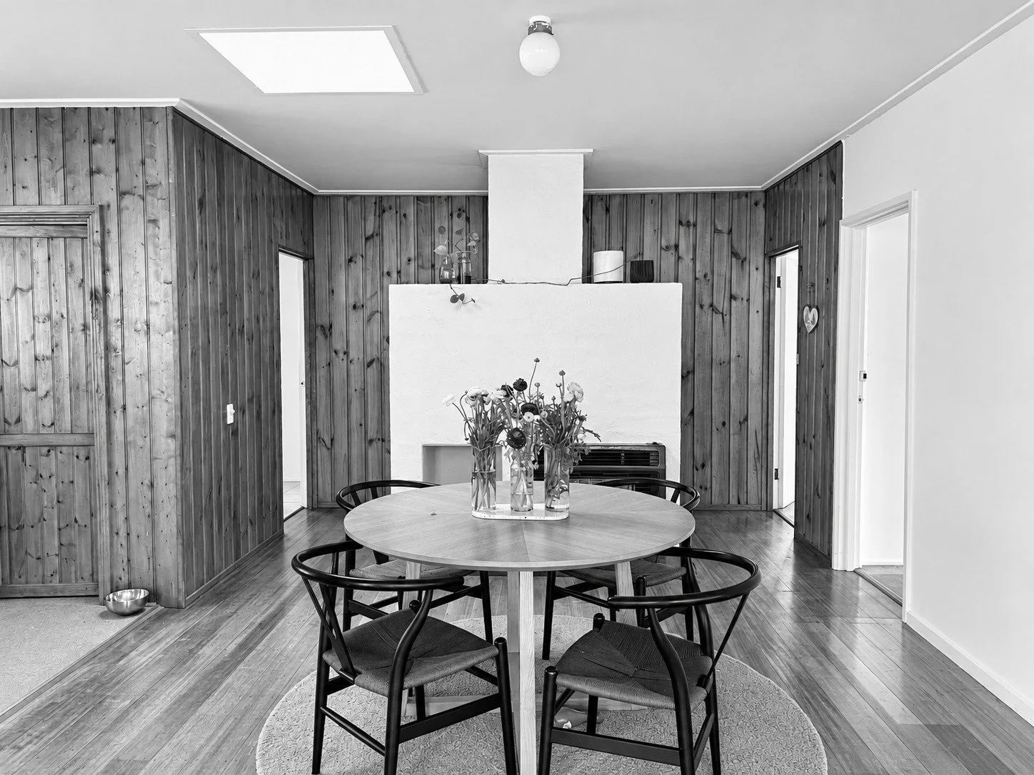 Before: the dining area with raw timber-lined walls