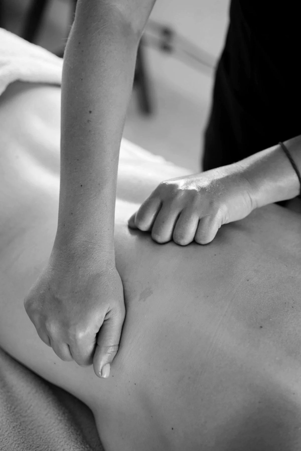 Therapist massaging a bare back