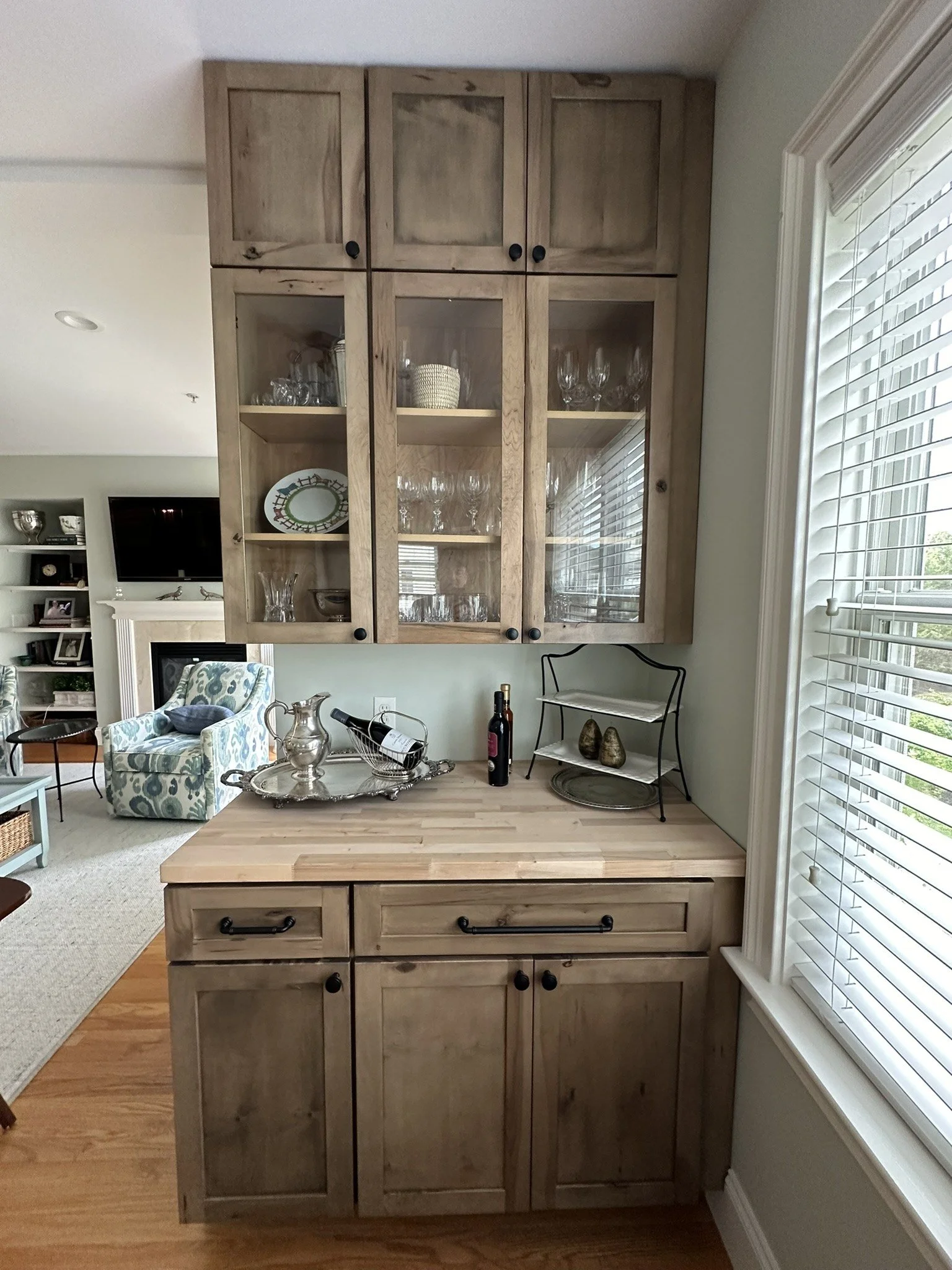 Wood base cabinet and glass-front upper cabinets